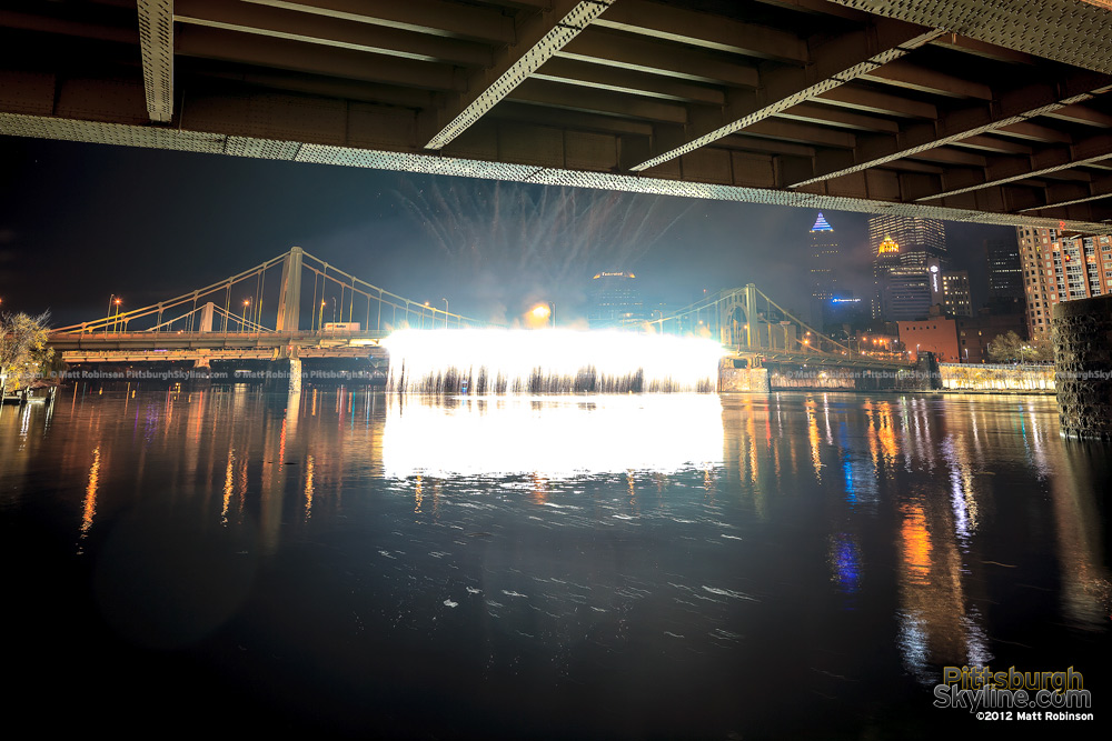 Waterfall fireworks stream brightly of the Andy Warhol Bridge during light up night Pittsburgh