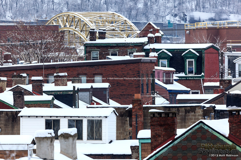 Snowy rooftops with 16th Street Bridge