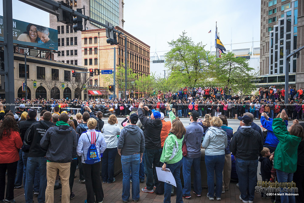 Spectators along Liberty Avenue watch runners during the Pittsburgh Marathon