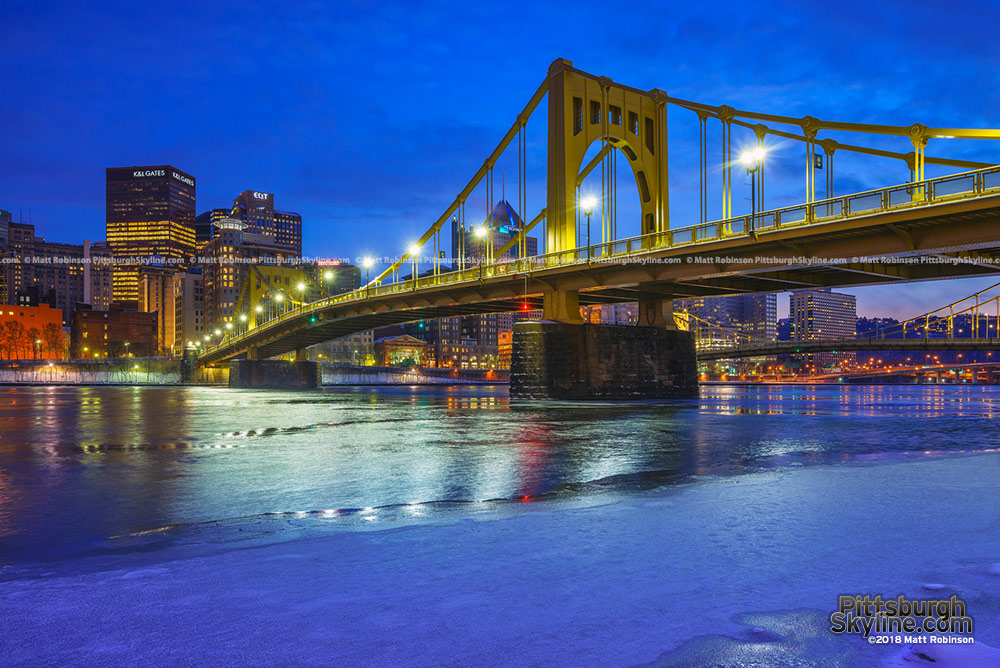 Icy covered Allegheny River with renovated Andy Warhol Bridge 2018